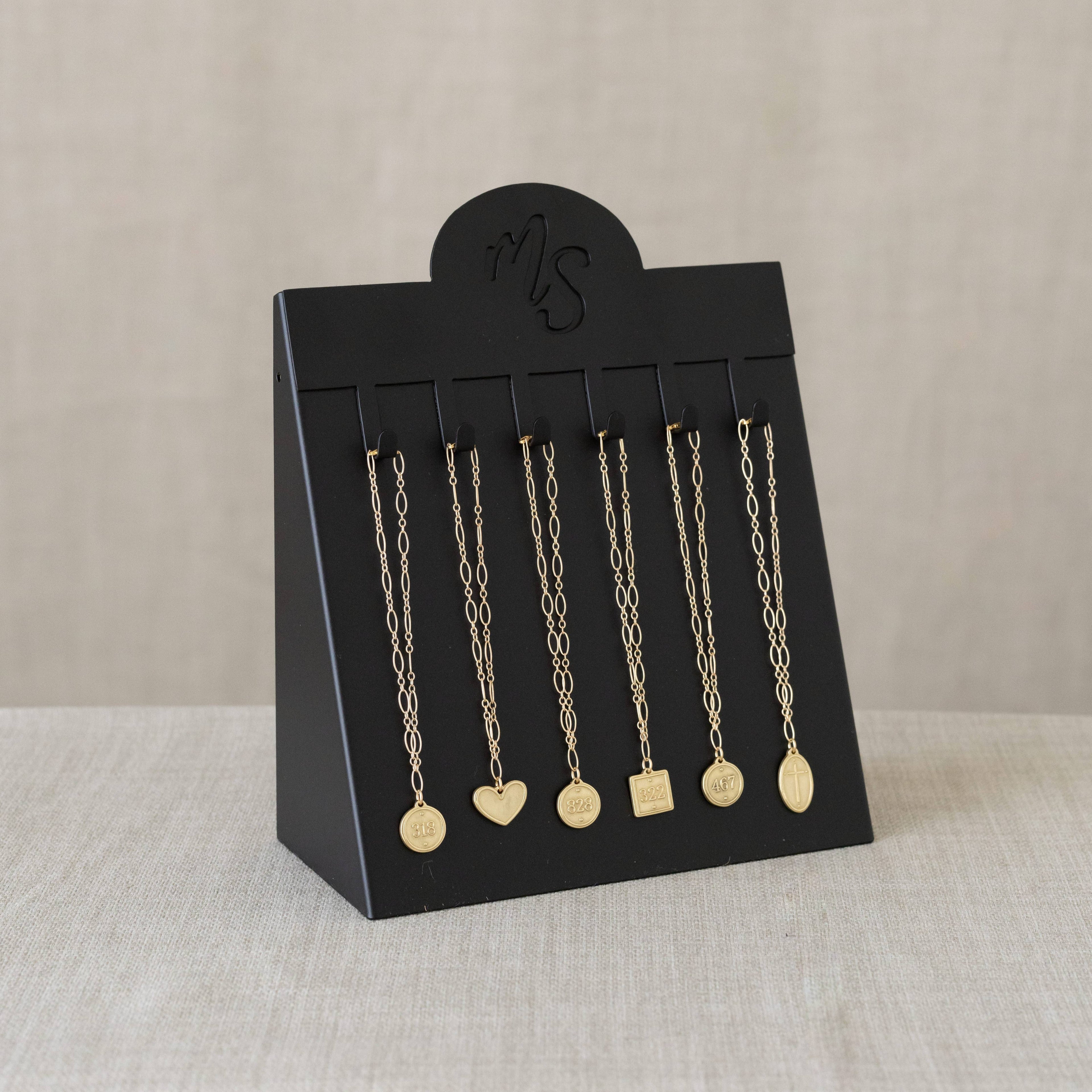 Bracelet (Petite Pendant) - Oval Cross / Romans 5:8